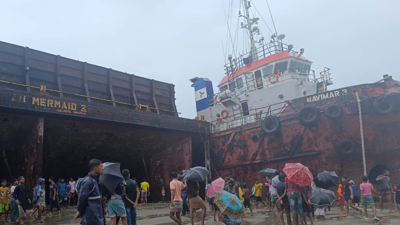 Coal-laden ship with cargo off the coast