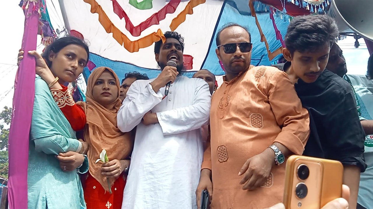 Akhtar Hossain at a road rally on the road adjacent to the Sadullapur Central Shaheed Minar