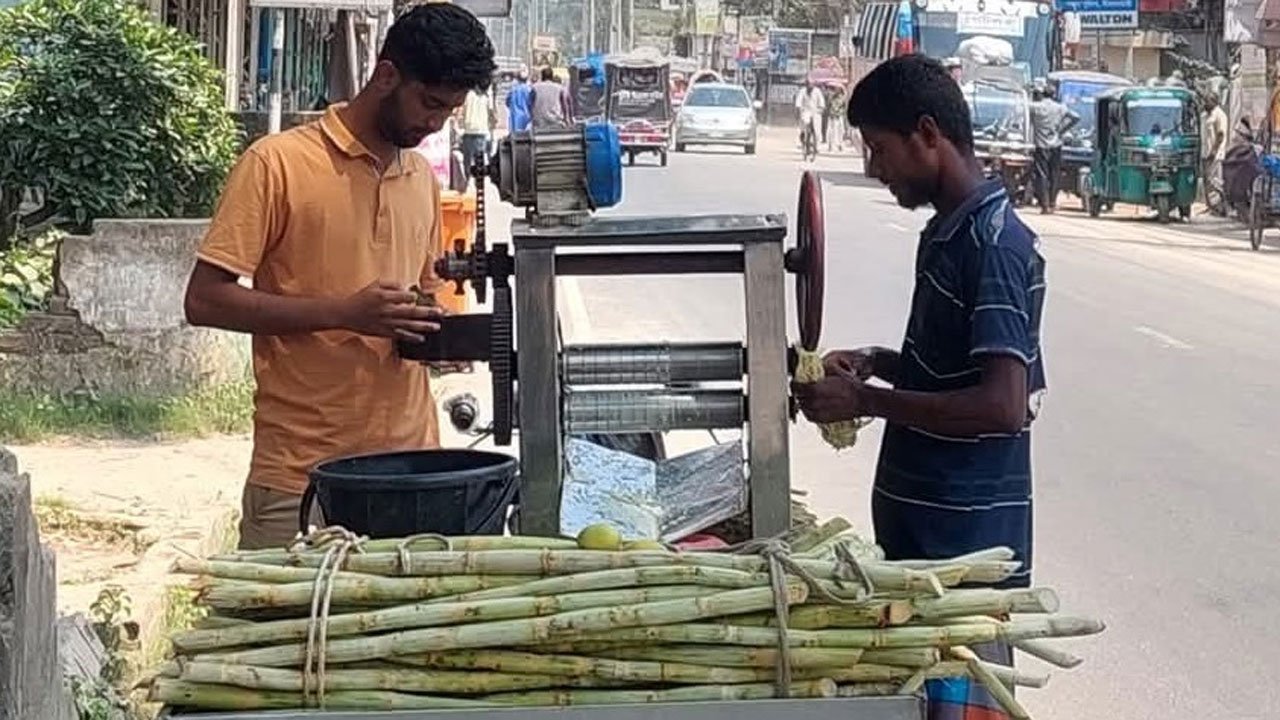 A customer buys sugarcane juice in the hope of relief from the heat.