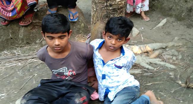 দুই শিশুকে গাছের সঙ্গে বেঁধে নির্মম নির্যাতন : আটক ২