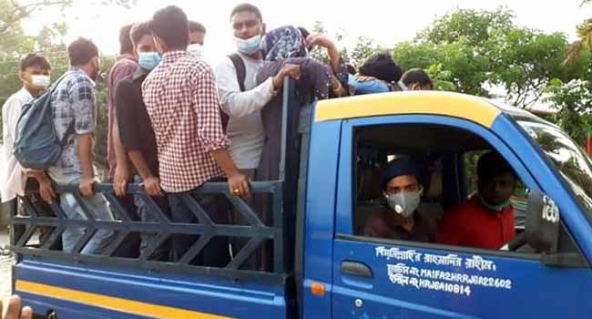 মানছে না করোনা নির্দেশ ভোগান্তি নিয়ে ধামরাইয়ে কর্মস্থলে ফিরছে শ্রমিকরা