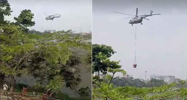 হাতিরঝিল থেকে পানি নিচ্ছে বিমান বাহিনীর হেলিকপ্টার