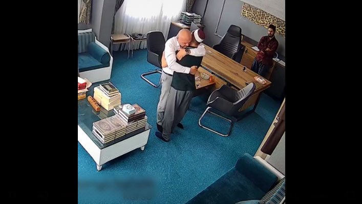Father-kisses-son's-feet-for-completing-Quran-memorization