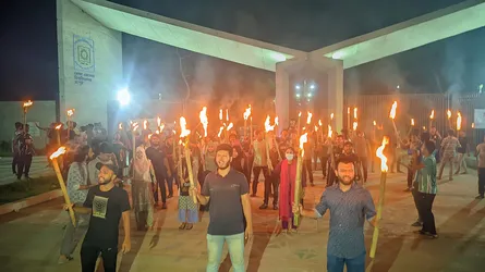 ঢাকায় হামলার প্রতিবাদে রোকেয়া বিশ্ববিদ্যালয় শিক্ষার্থীদের মশাল মিছিল