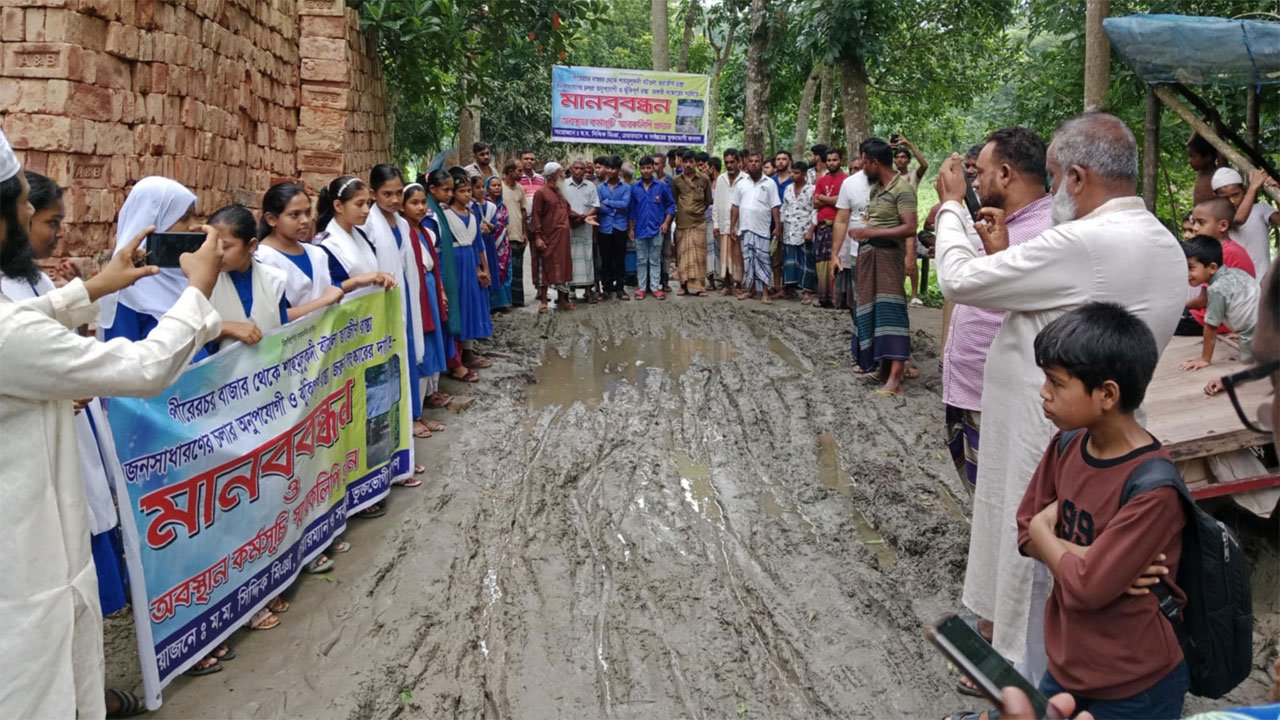 Young-school-going-students-suffer-on-muddy-roads-in-Bhanga